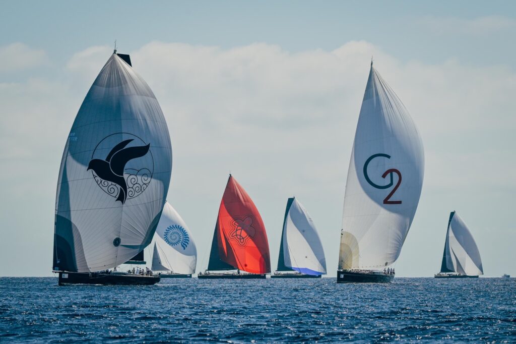 Racing sailing yachts under spinnaker